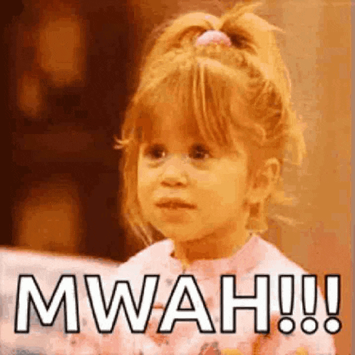 a little girl with a ponytail is sitting on a couch and making a funny face .