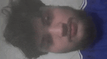 a close up of a person 's face with smoke coming out of it .
