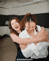 two women hugging each other with the hashtag mysafezoneth on the bottom