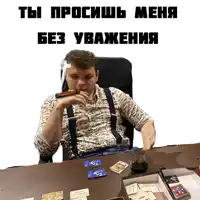 a man is sitting at a table with a glass of wine and a cigar in his mouth