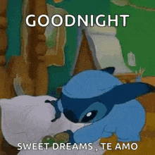 a cartoon character is laying on a bed with a pillow and a goodnight message .