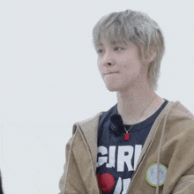 a young man wearing a t-shirt that says girl on it