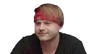 a man wearing a red headband with the letter g on it
