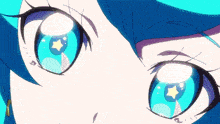 a close up of a girl 's blue eyes with a star in the middle .