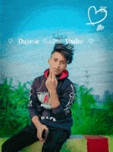 a young man sitting on a bench with the name dujone sudhi vasbo written on the bottom