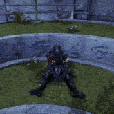 a video game character laying on the grass with a sword in his hand