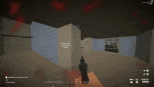 a screenshot of a video game shows a person holding a gun in front of a brick wall