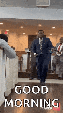 a man in a suit and tie is walking down a hallway in a church and says `` good morning '' .