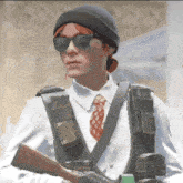 a woman wearing a beanie and sunglasses holds a gun