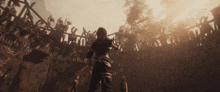a man standing in front of a crowd of people with a sword