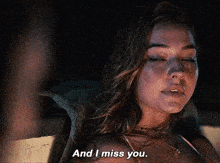 a woman says " and i miss you " in a dark room