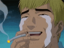 a man is smoking a cigarette and crying while holding a cigarette in his hand .
