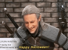a man in a knight costume is smiling and says happy halloween