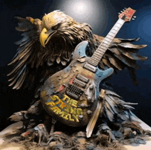 a statue of an eagle and a guitar that says the strong family