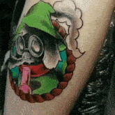 a person has a tattoo of a cartoon character on their leg .