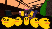 a bunch of yellow ducks are standing next to each other and one of them has the name verriet on it