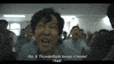 a man is screaming in front of a crowd and says thunderflash brings it home