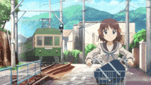 a girl is riding a bike in front of a train that says ' n ' on it