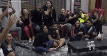 a group of people are sitting in a room with the hashtag #dfpowercouple