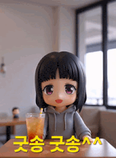 a doll is sitting at a table with a glass of iced tea in front of her