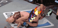 a pixelated image of a fighter laying on the ground with the word bellator mma on the bottom