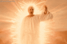 a man in a white robe is surrounded by a glowing light and says " avaunt "