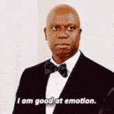a man in a tuxedo and bow tie is saying `` i am good at emotion '' .