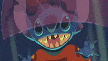 a close up of a cartoon character with a huge mouth and teeth holding an umbrella .