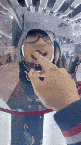 a person taking a picture of themselves in a mirror with their mouth open