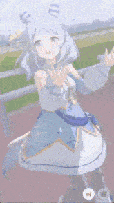 a girl in a blue and white dress with horns is standing on a track .