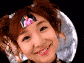 a girl with a picture of a child on her head
