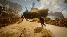a group of people running down a dirt road in a video game
