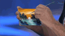 a person holding a piece of paper with talent written on the bottom