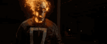 a ghost rider with flames coming out of his head .