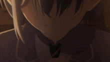 a close up of a girl 's face with a sad look on her face