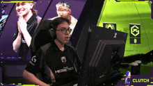 a man wearing headphones and a shirt that says heretics