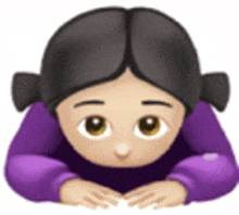 a girl in a purple sweater is laying on her stomach with her hands on her head .