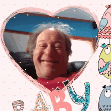 a man in a red shirt is smiling in a heart shaped frame with the letters a and y on it