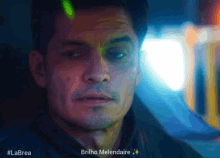a close up of a man 's face with the words brilho melendaire in the corner