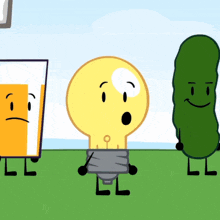 a light bulb a glass of beer and a pickle are standing in the grass