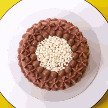 a chocolate cake with white sprinkles on it