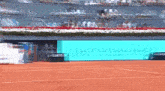 a tennis court with a sign that says mercedes-benz