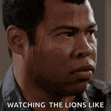 a man sweating with the words watching the lions like behind him