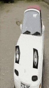 a white car with a license plate that says p226 vwc
