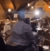 a blurry picture of a room with a lot of papers