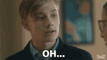 a boy says " got it " in front of a picture
