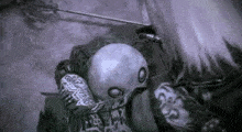 a person is holding a sword in a video game and looking at a skull .