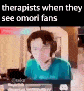 a man wearing headphones is sitting in front of a computer screen with the words " therapists when they see omori fans "