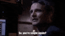 a man in a suit is looking at a computer screen and saying `` so you 're single again ? ''