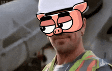 a man wearing a hard hat and safety vest is wearing a pig mask